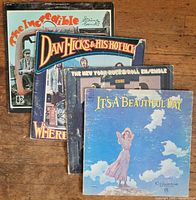 Front view of all four album covers spread, showing titles and artwork