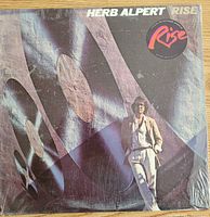 Front cover of Herb Alpert "Rise" LP in shrink wrap