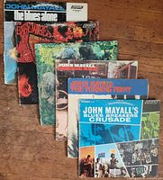 Six John Mayall album covers fanned out on floor