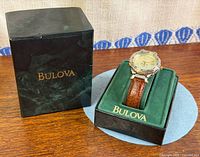 Watch in display box beside outer box