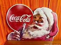 Front view of Coca-Cola Santa foam sign