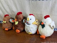 Group shot of four San-Ei plush chickens lined up