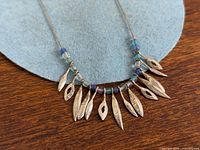 Full view of sterling silver fringe necklace laid flat