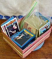Wooden crate holding several stacks of trading cards