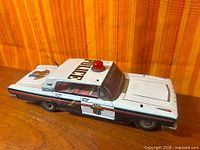 left side view showing livery, roof light, antenna