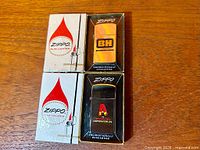 Both Zippo Slim Lighter boxes with lighters displayed