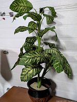 Full view of artificial plant showing height and foliage