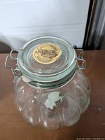 Top view showing Annabelles label on glass lid and wire clasp