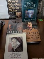 Group shot of all five hardcover books upright and overlapping