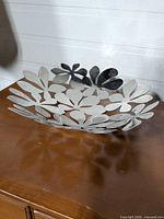 Top view of metal floral cut-out dish