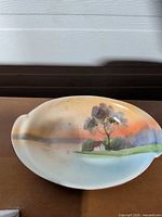 Top view showing entire Noritake dish and painted landscape