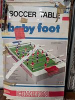 Front of retail box displaying Soccer Table game, visible wear and tape
