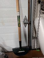 Full view of Yardworks lawn edger showing wooden handle and blade
