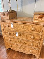 Front angled view of entire pine dresser showing drawers and worn paint