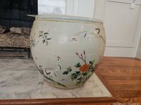 Side view showing crane and peony decoration on porcelain planter