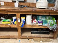 Shelf showing full lot: wipes, paper towel, toilet paper, boxed and pocket tissues