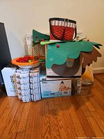 Overall lot showing safety gate, wipes box, foam tiles, basket, toys, air pump, hiccapop box