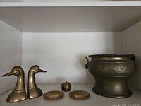 Full lot showing bookends, planter/urn, dishes and lidded box
