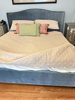 Full view of assembled upholstered bed frame showing color and style