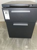 Front view of charcoal metal two-drawer cabinet