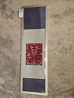 Full length view of framed textile panel showing entire item