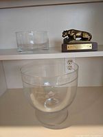 Shelf view with glass bowl award, cylindrical glass bowl, Penn State trophy