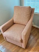Front view of CR Laine armchair showing upholstery and overall form