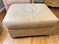 Front and top view of leather ottoman