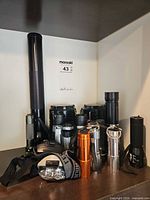 Group view of all lanterns, flashlights and headlamps on shelf