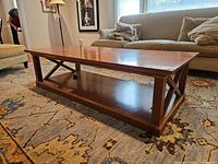 Full view of coffee table on rug