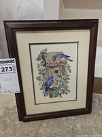 Full view of framed cross stitch artwork