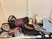 Group of five assorted bags on shelf