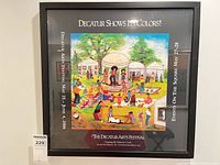 Frontal view of the framed poster showing artwork, title and event details