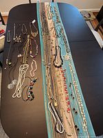 Overview of all necklaces laid out on table
