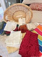 overall lot showing basket and assorted linens