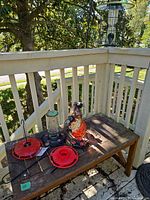 Bench with multiple feeders and hook visible