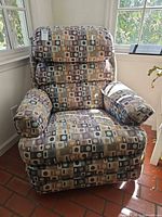 Front view of recliner showing overall condition, pattern and upholstery
