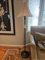 Full view of first floor lamp with shade