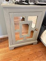Front view of PL Langford nightstand showing mirrored door and knob