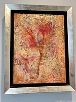 Front view of framed artwork showing composition and frame
