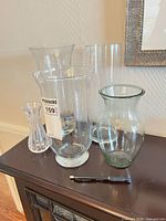 All five vases grouped on cabinet