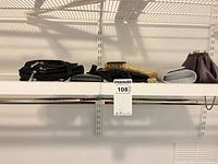 Assorted bags stacked on shelf