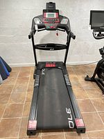 Full view of Sole F63 treadmill showing deck, rails and console