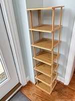 Full view of bamboo corner tower shelf showing seven tiers
