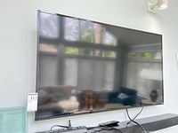 Front view of 50-inch Vizio TV mounted on wall