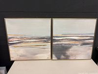 Front view of both framed artworks side by side