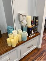 Overall view of boxed and loose candles on shelf