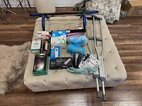 Overview of lot on ottoman showing all items