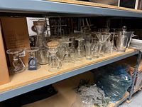 Full shelf view showing assorted glassware grouping