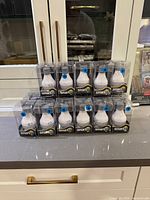 Front view of 17 sealed Abbott Smartlite packages stacked on countertop